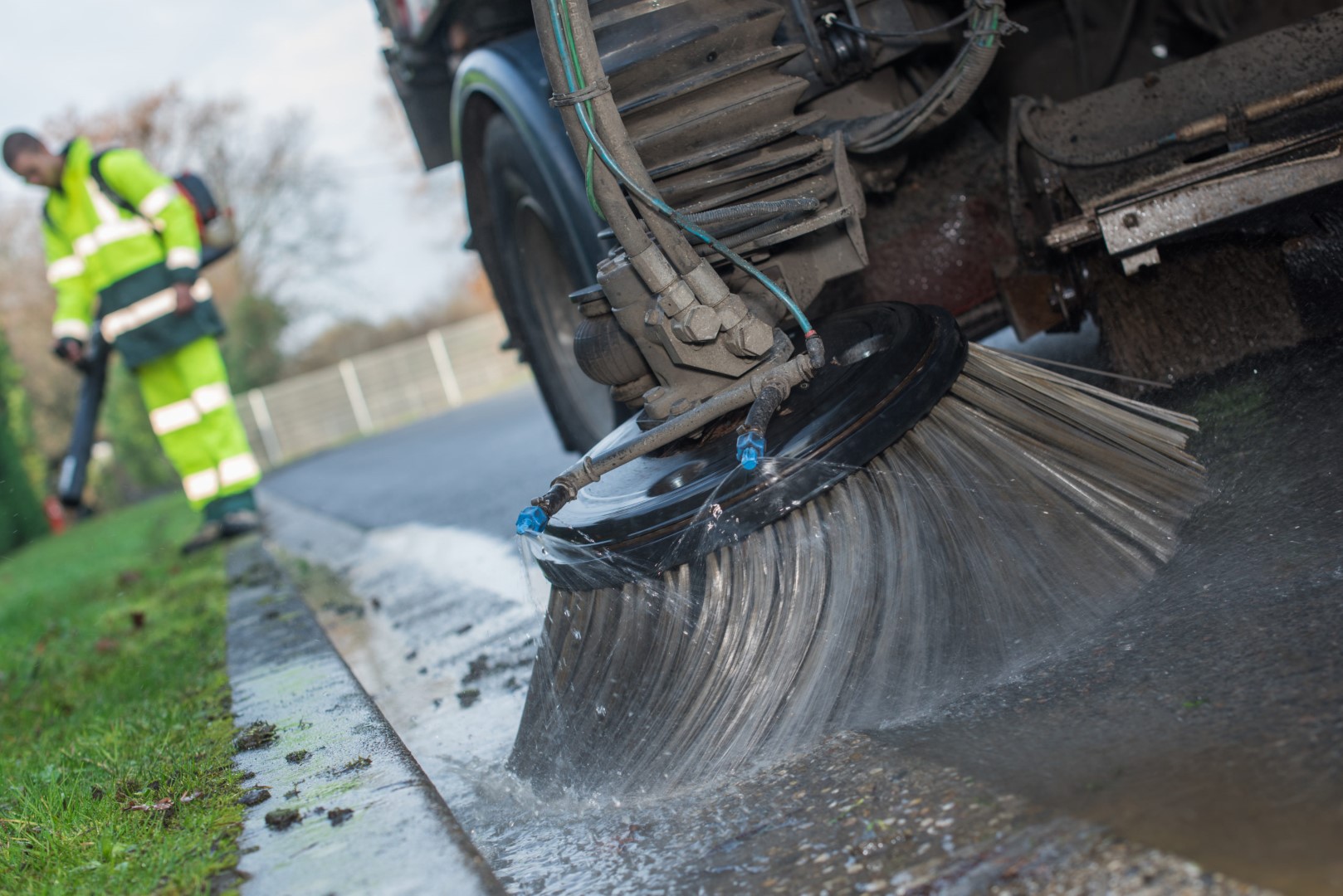 close up from parts of a street cleaning vehicle netturbino che pulisce strada